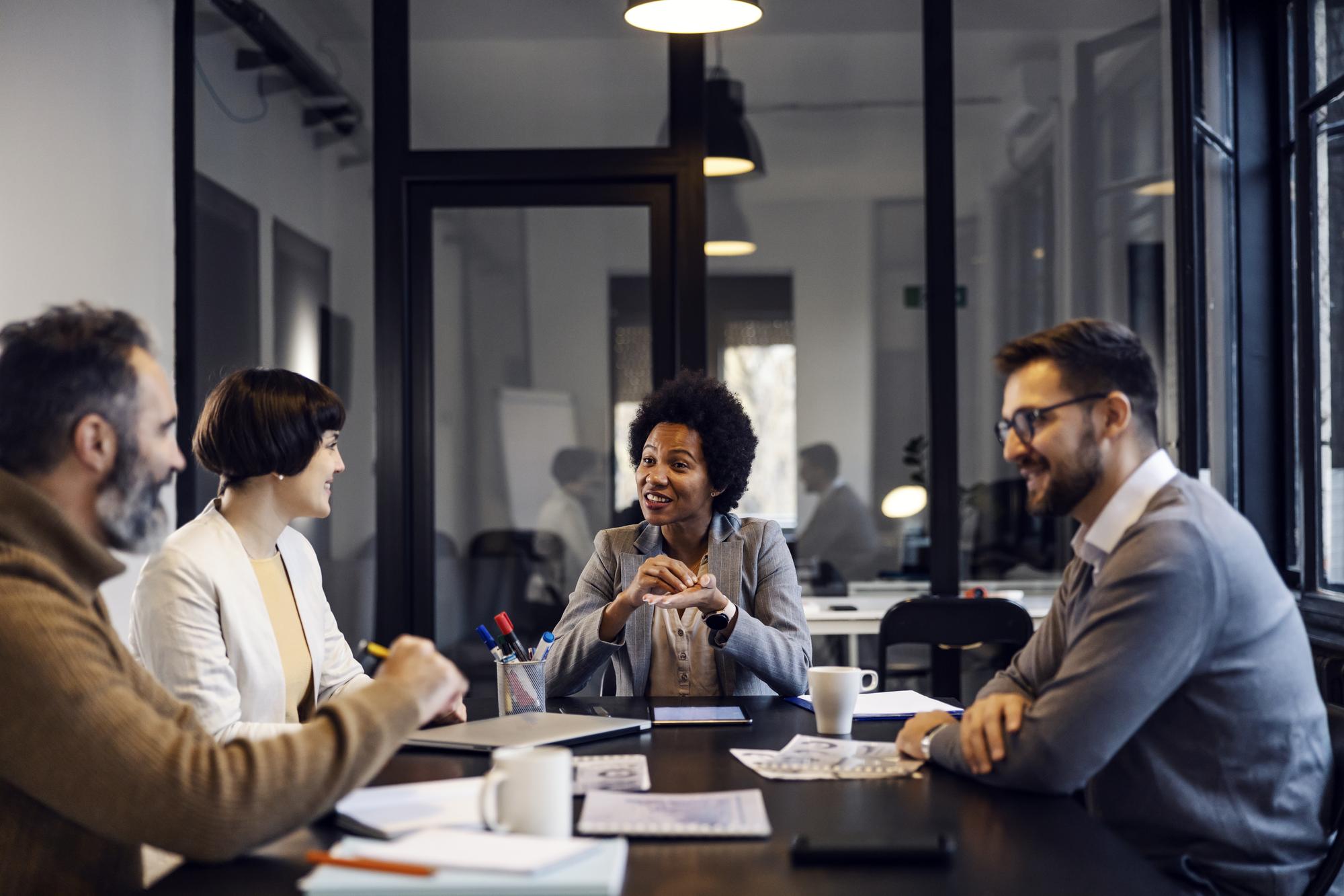 Corporate lawyers reviewing business contracts and legal documents for client protection